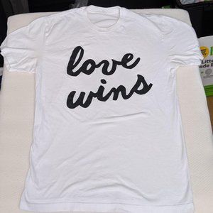 cursive "love wins" lgbtq+ pride shirt